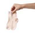 Woman holding pair of cute child socks on white background Royalty Free Stock Photo