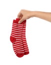 Woman holding pair of cute child socks on white background Royalty Free Stock Photo