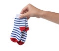 Woman holding pair of cute child socks on white background Royalty Free Stock Photo