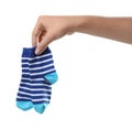 Woman holding pair of cute child socks on white background Royalty Free Stock Photo