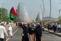 a woman holding a Palestinian flag