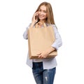 Woman holding a paper bag smartphone mobile phone shopping beauty