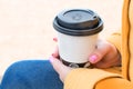 Woman holding a paper coffee cup in her hand, women with the cup of coffe Royalty Free Stock Photo