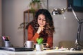 Woman holding papers in her hands, calculating family budget Royalty Free Stock Photo