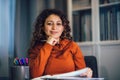 Woman holding papers in her hands, calculating family budget Royalty Free Stock Photo