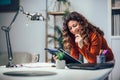 Woman holding papers in her hands, calculating family budget Royalty Free Stock Photo