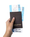 Woman holding passport with tickets on white background, closeup. Travel agency concept