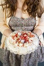 Woman holding Pavlova