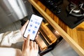Controlling kitchen appliances with a smart phone Royalty Free Stock Photo