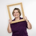 Woman holding picture frame. Royalty Free Stock Photo