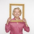 Woman holding picture frame. Royalty Free Stock Photo