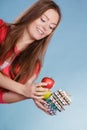 Woman holding pills and fruits. Health care Royalty Free Stock Photo