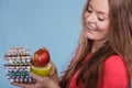 Woman holding pills and fruits. Health care Royalty Free Stock Photo