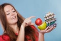 Woman holding pills and fruits. Health care Royalty Free Stock Photo