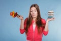 Woman holding pills and vegetables. Health care Royalty Free Stock Photo