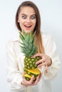 Woman holding pineapple in section