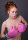 Woman Holding Pink Boxing Gloves in Front of Chest Royalty Free Stock Photo