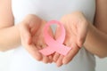 Woman holding pink ribbon, closeup. Breast cancer awareness concept Royalty Free Stock Photo