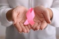 Woman holding pink ribbon, closeup. Breast cancer awareness concept Royalty Free Stock Photo