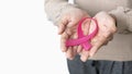 Woman holding pink ribbon. supporting symbol of breast cancer awareness and international women day campaign