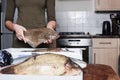 Woman holding a plaice and other fish