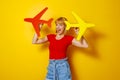 Woman holding plane as summer vacation and air travel concept Royalty Free Stock Photo