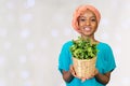 Woman holding plant in vase Royalty Free Stock Photo