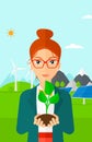 Woman holding plant. Royalty Free Stock Photo