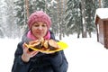 Woman holding plate of grilled Coho Salmon Fillets