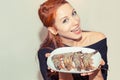 Woman holding plate with shrimps on white grey background Royalty Free Stock Photo