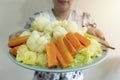 Woman holding plate with vegan or vegetarian food. Healthy plant based diet Royalty Free Stock Photo