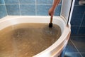 Woman holding a plunger to unblock drain Royalty Free Stock Photo