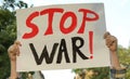 Woman holding poster with words Stop War outdoors, closeup Royalty Free Stock Photo