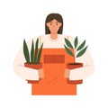 Woman holding potted plants