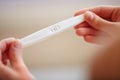 Woman Holding Pregnancy Test. Positive. Royalty Free Stock Photo