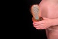 Woman holding a prickly cactus, problems with pain and discomfort during pregnancy Royalty Free Stock Photo