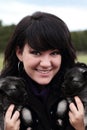 Woman Holding Puppies