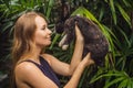 Woman holding a rabbit. Cosmetics test on rabbit animal. Cruelty free and stop animal abuse concept Royalty Free Stock Photo