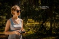 Woman holding radio controller and flying a drone