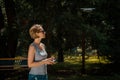 Woman holding radio controller and flying a drone