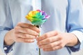 Woman holding rainbow rose flower Royalty Free Stock Photo