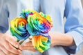 Woman holding rainbow rose flowers Royalty Free Stock Photo