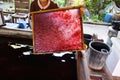 Woman holding raw material fixed in a frame for paper umbrellas at Bo Sang village, Chiang Mai, Thailand