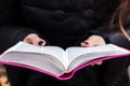 Woman holding and reading bible Royalty Free Stock Photo