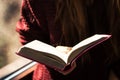 Woman holding and reading bible Royalty Free Stock Photo