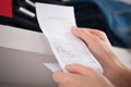 Woman Holding Receipt In Store