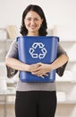 Woman Holding Recycling Basket