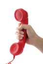 Woman holding red corded telephone handset on white background. Hotline concept Royalty Free Stock Photo