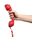 Woman holding red corded telephone handset on white background, closeup. Hotline concept Royalty Free Stock Photo