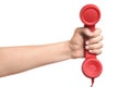 Woman holding red corded telephone handset on white background, closeup. Hotline concept Royalty Free Stock Photo